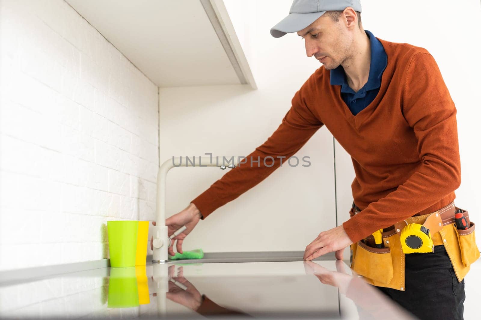 Young male worker checking gas.