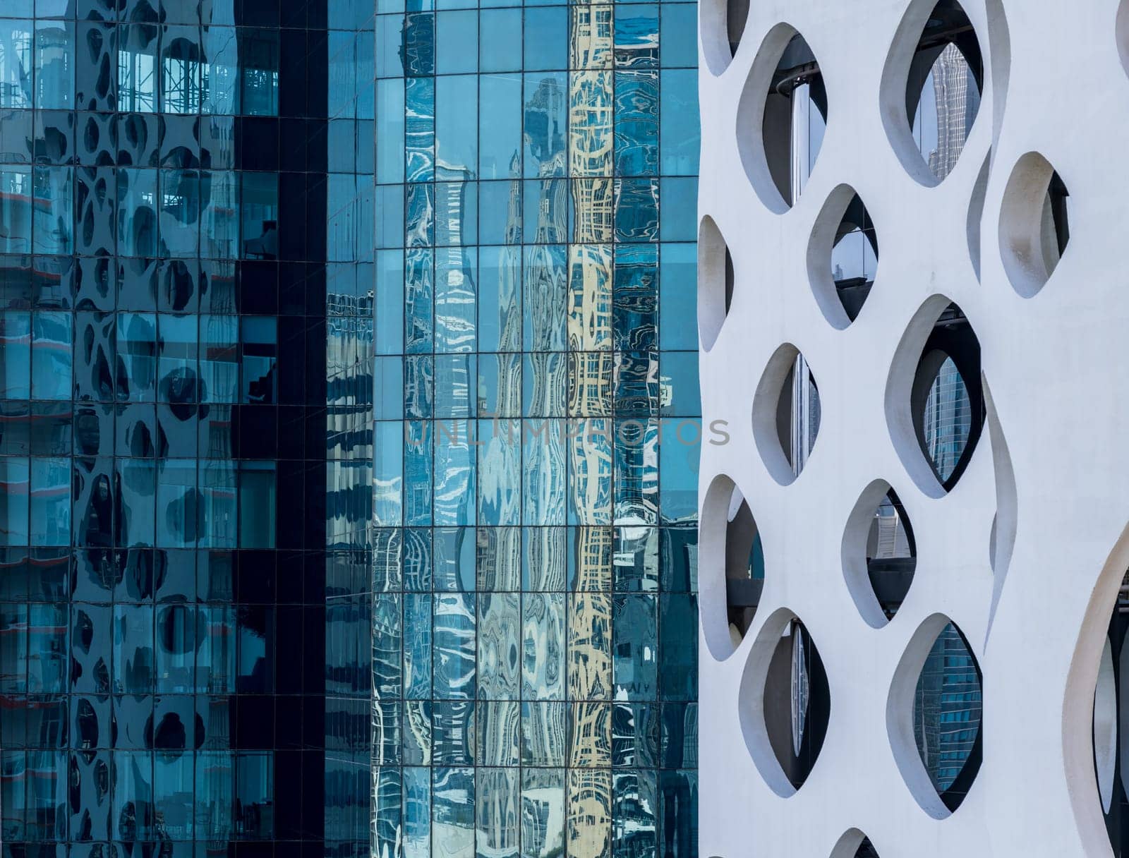 Detail of the facades of apartment blocks and towers in the Business Bay area of Dubai in UAE