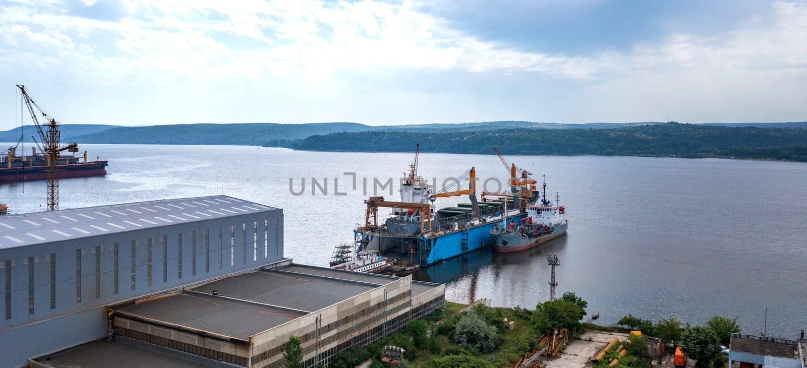 Aerial view from a drone of a ship repair yard with ships. Water transport