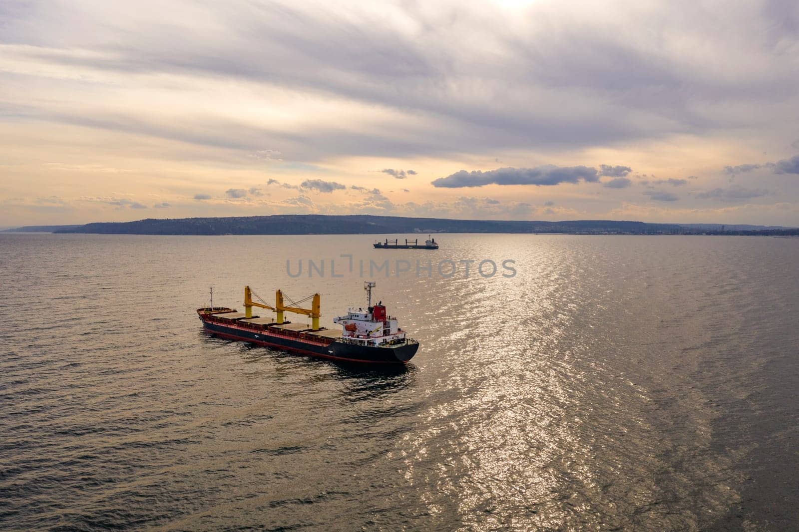 Large ship at sea. Aerial top view of cargo ship vessel import export sailing.