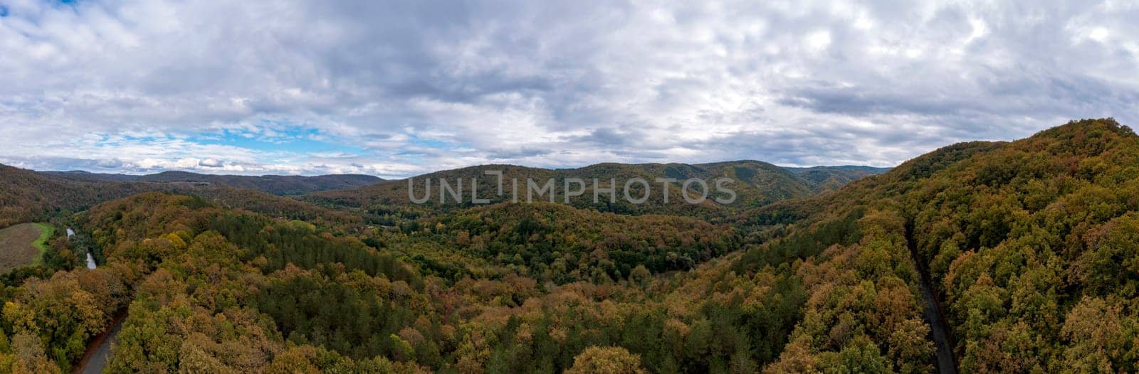 Hilltops covered with autumn forest. by EdVal