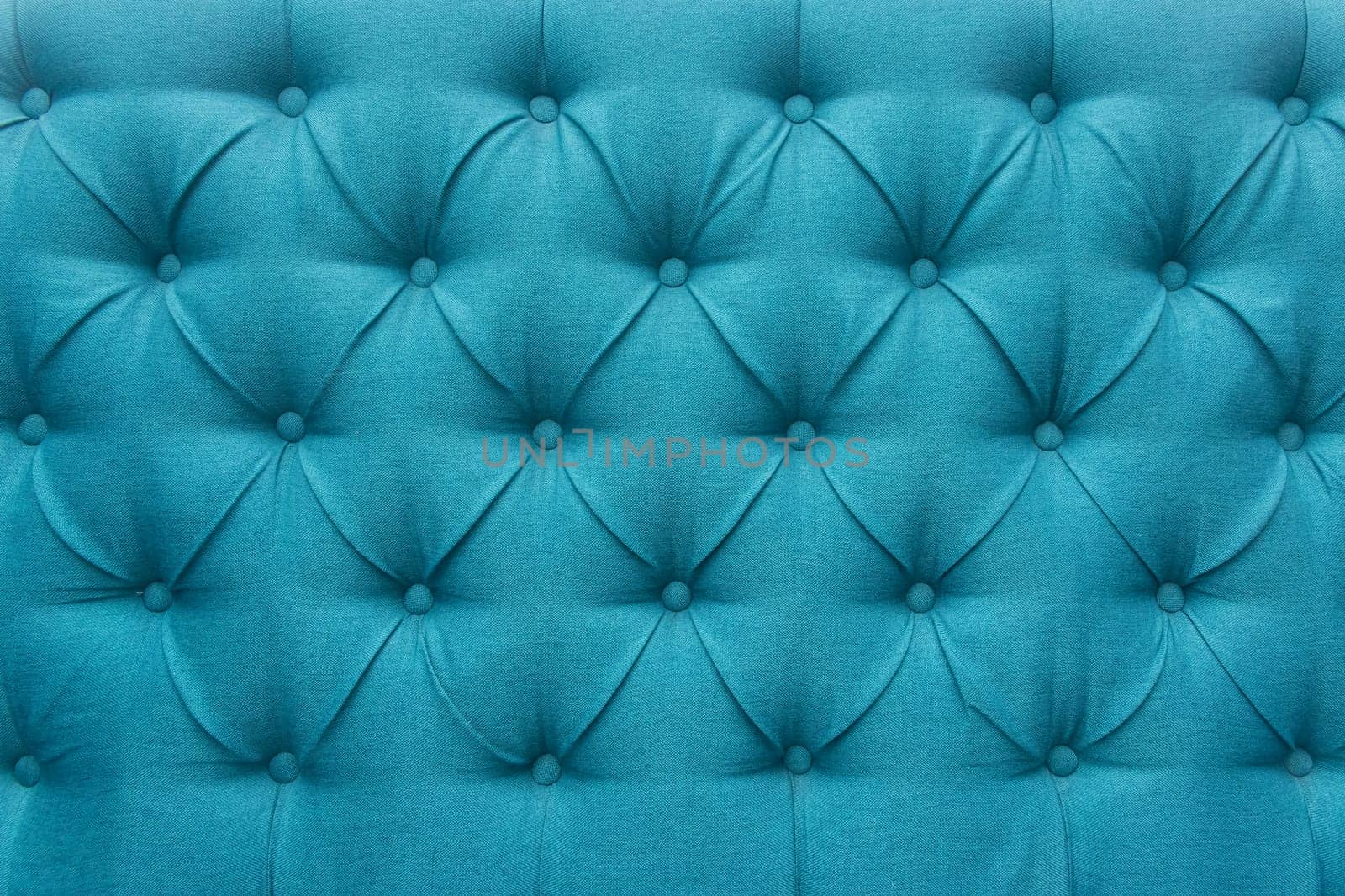 Blue leather upholstery sofa pattern button design furniture style decor texture background decoration vintage abstract.