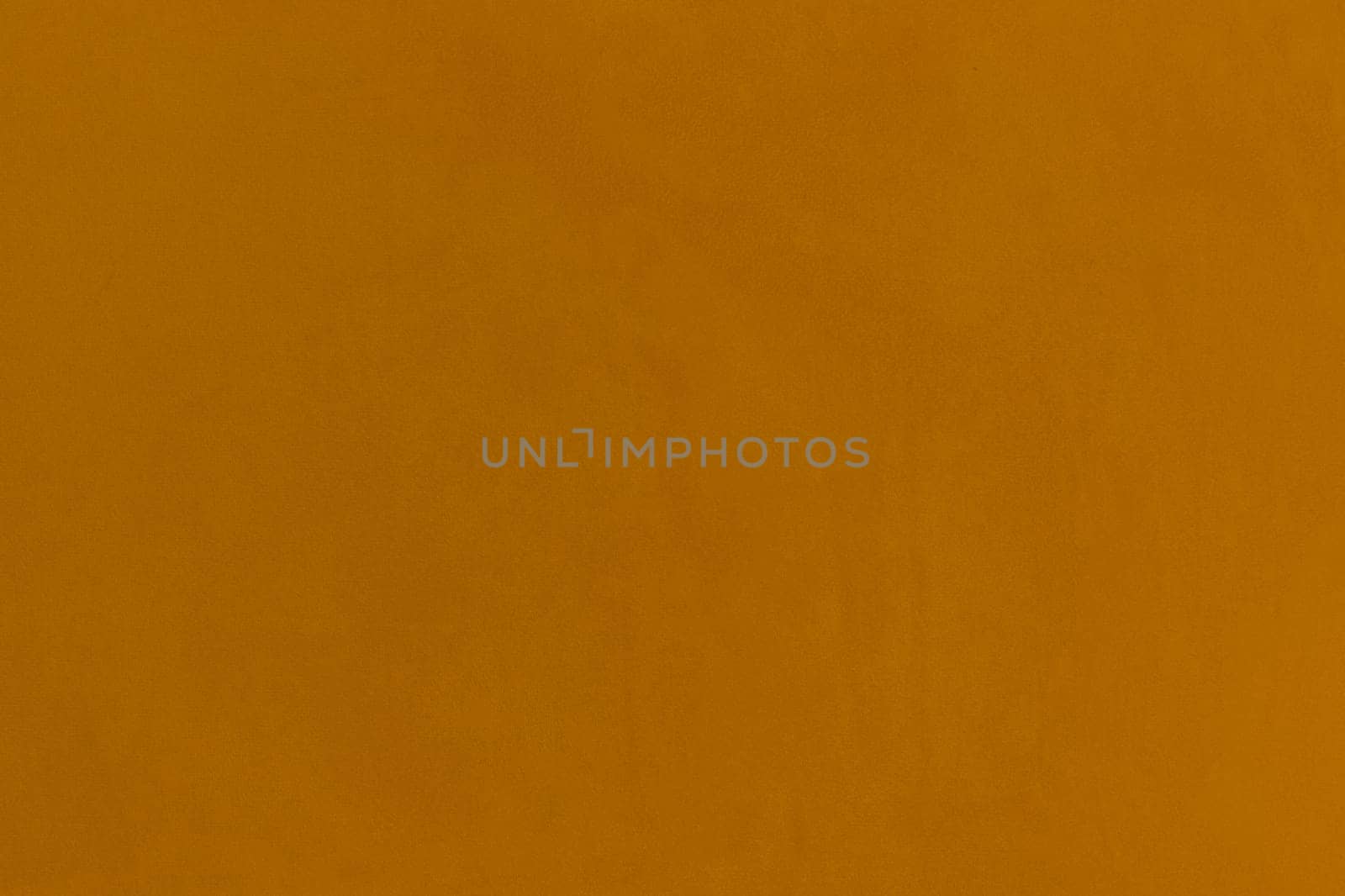 Mustard brown color wall texture blank background surface plaster abstract empty.