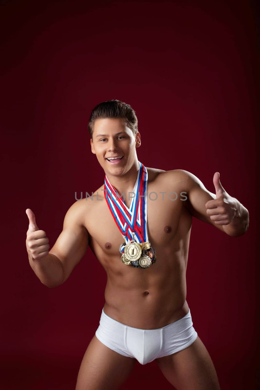 Smiling athlete poses with award-winning, close-up