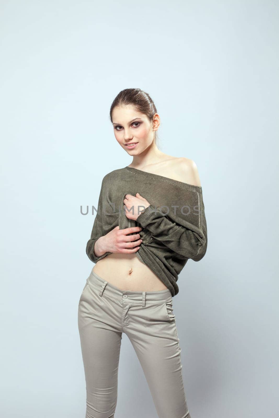 Smiling young model posing in stylish clothes, close-up