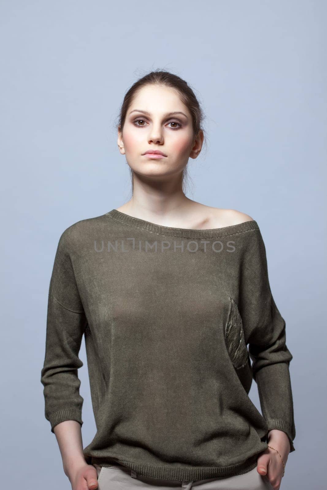 Portrait of slender model posing in modern clothes, close-up