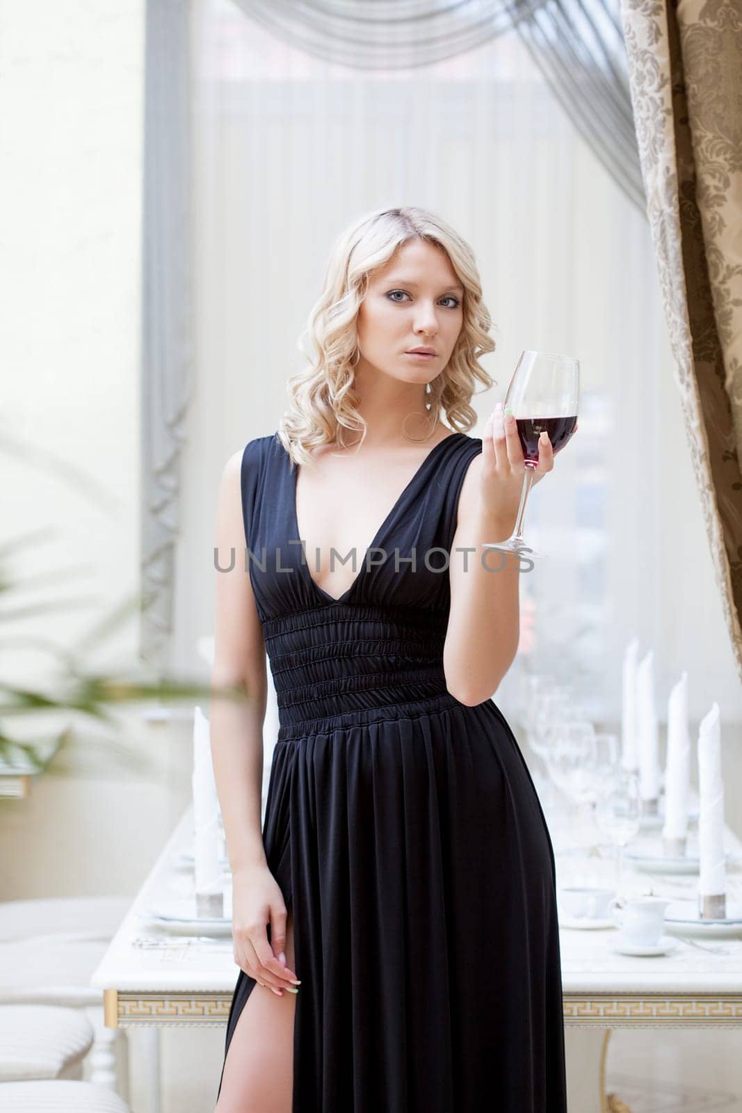 Image of charming woman in elegant black dress, close-up