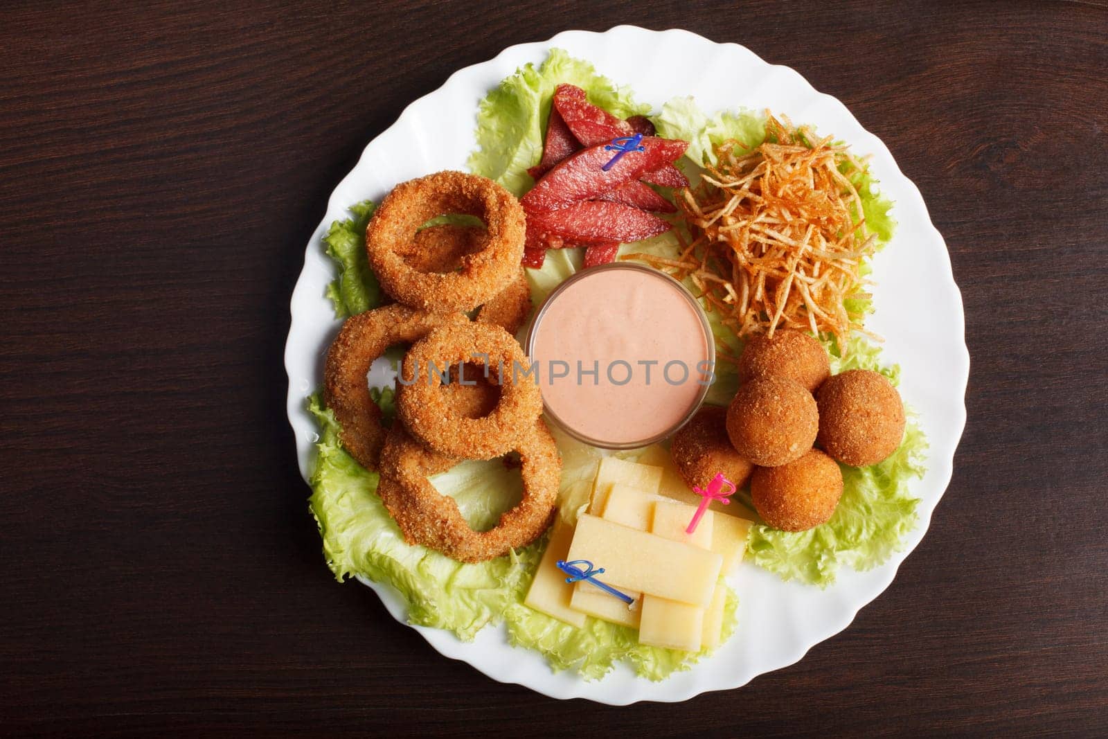 Image of crispy flavored snacks on plate, close-up