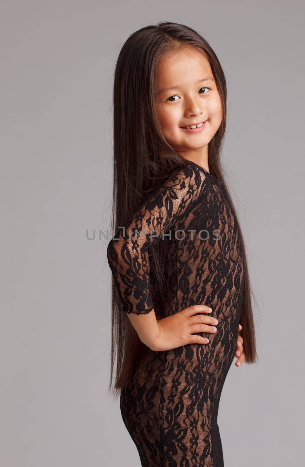 Portrait of elegant young brunette in lace dress, close-up