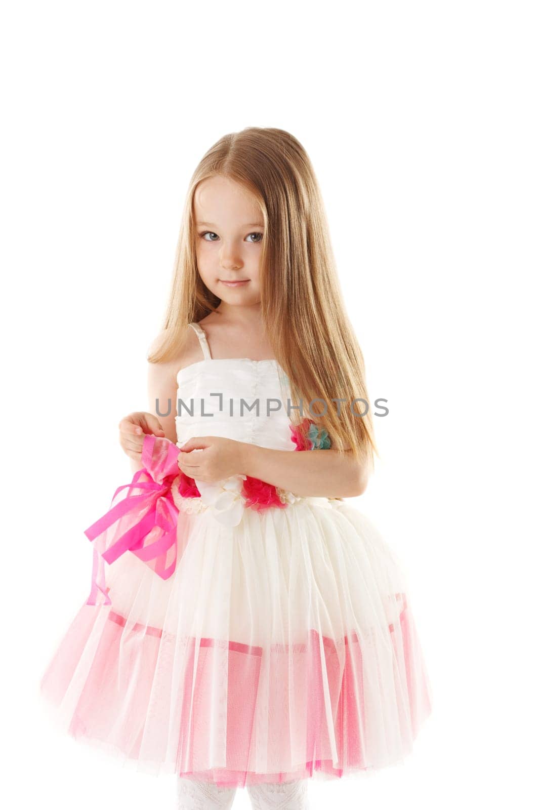 Smiling pretty little girl with long brown hair, isolated on white