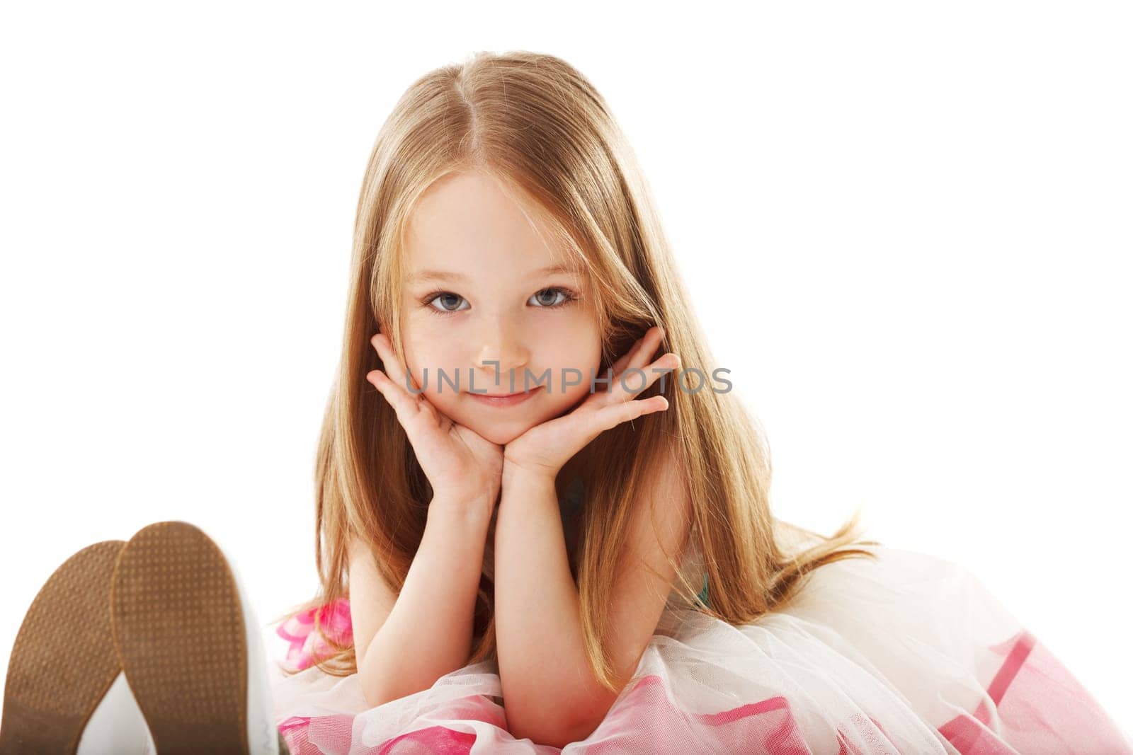 Portrait of little smiling girl looking at camera, close-up