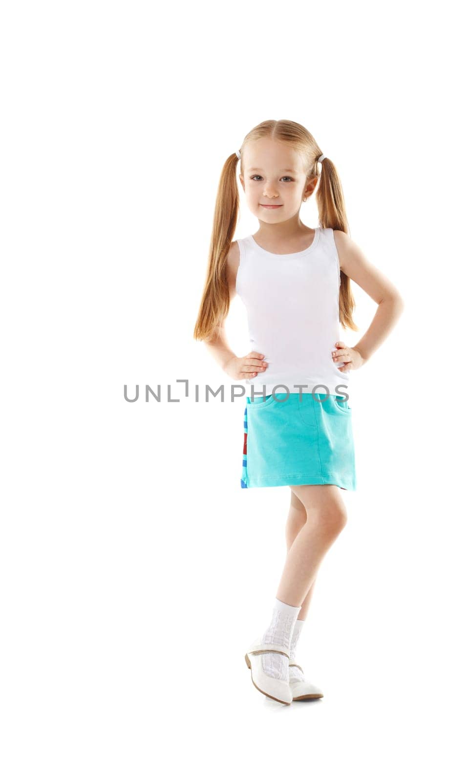 Cute little girl posing in casual clothes, isolated on white