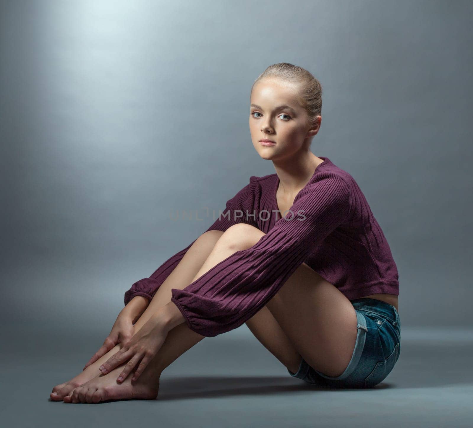 Pretty girl in stylish clothes looking at camera, close-up
