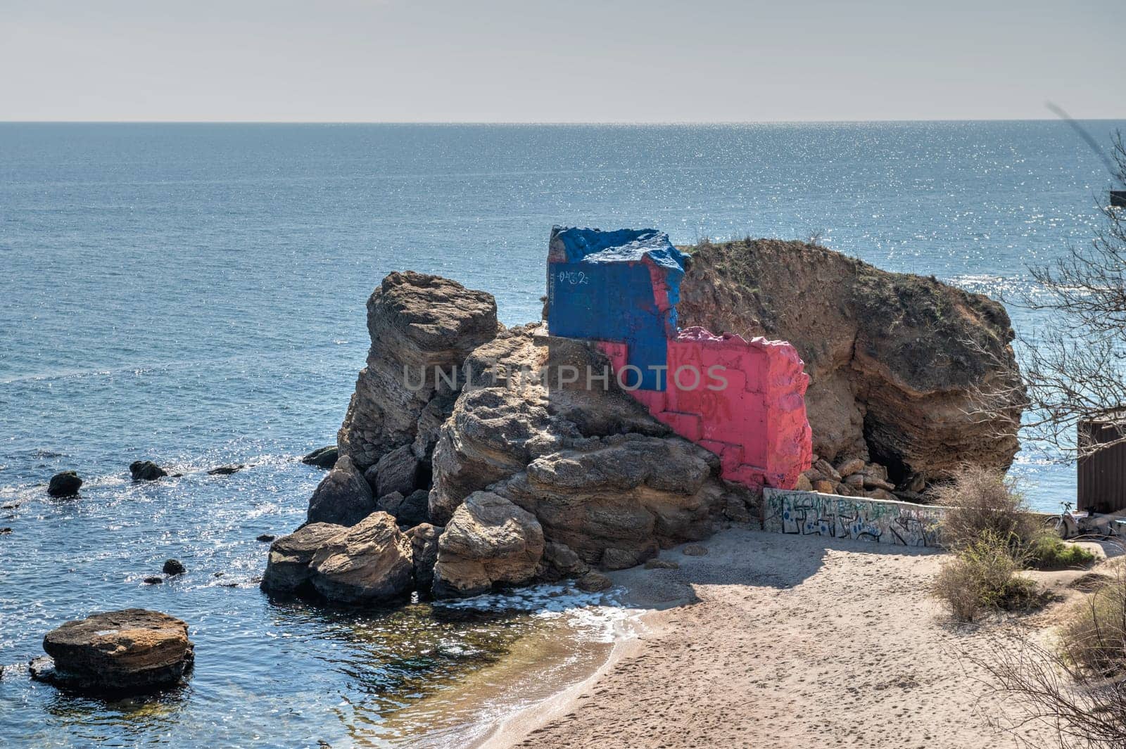 Shell rock boulders on the seashore on the Wild Beach in Odessa, Ukraine, on a sunny spring day