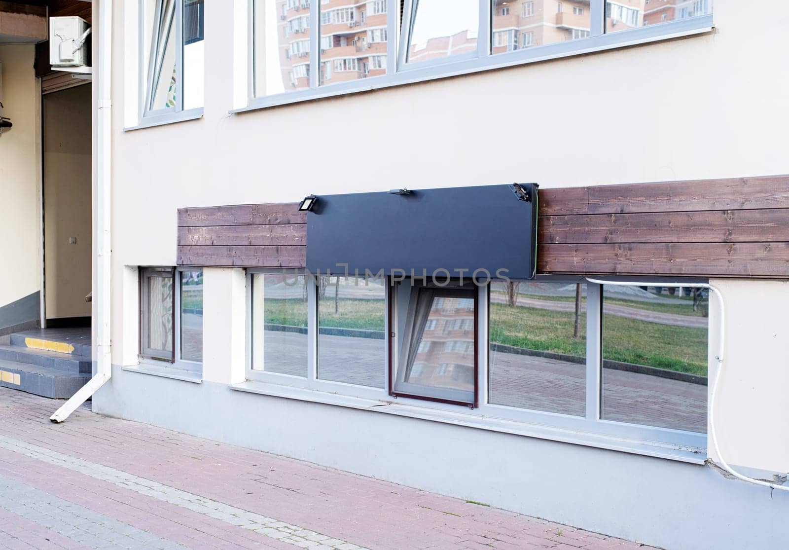 real establishment exterior with white walls , white logos for mockup design by Desperada