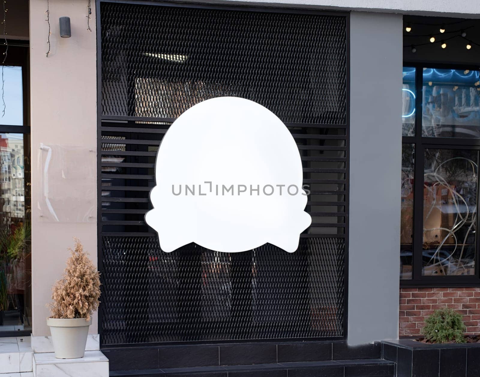 white round logo on building wall , exterior for mockup design by Desperada