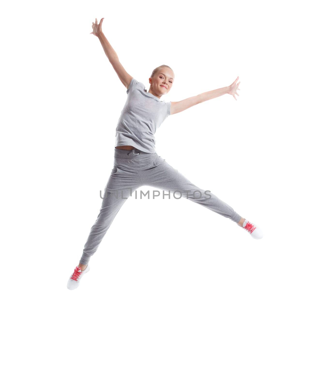 Image of joyful slim girl posing in jump, isolated on white