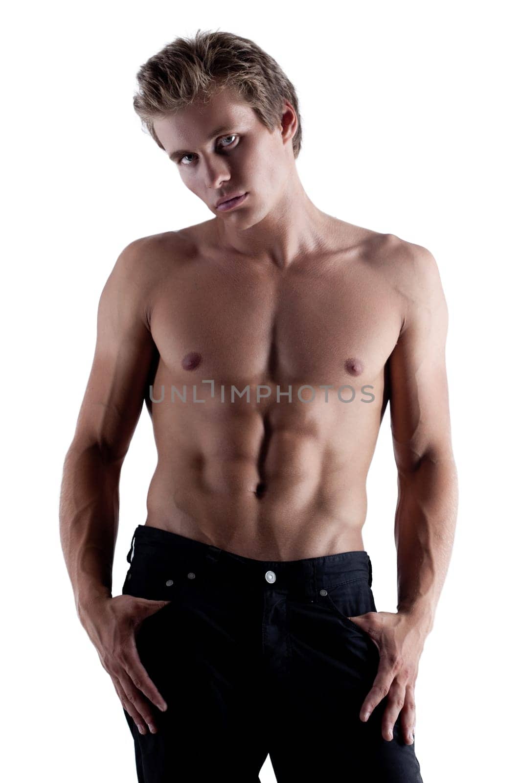 Portrait of sporty blond man posing in studio, isolated on white