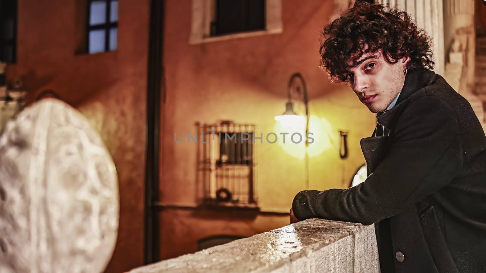 Lost in Thought: Thoughtful Young Man Leaning on Handrail in City at Night by pippocarlot