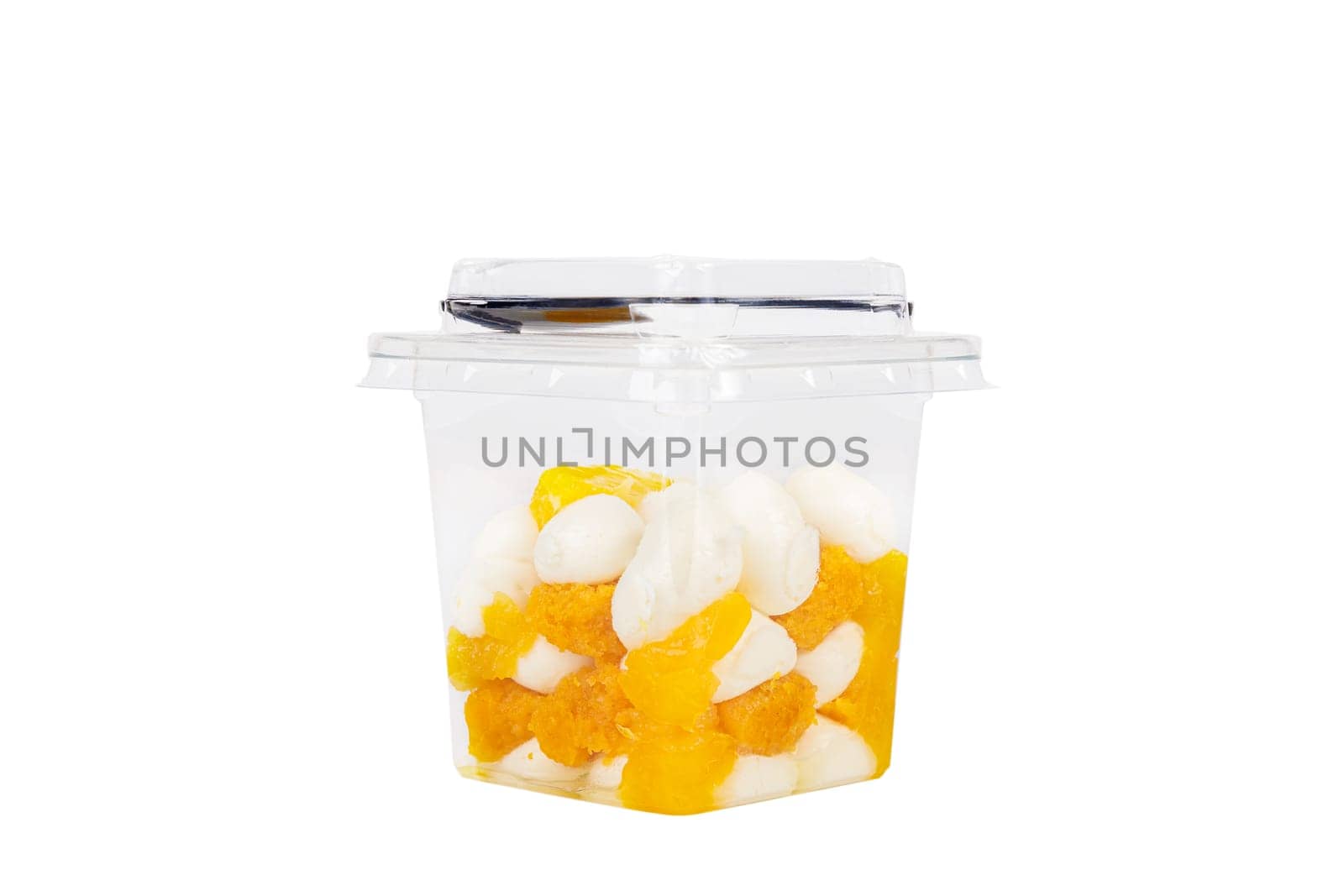 Dessert of cream, jam and orange in a plastic glass on a white background. High quality photo