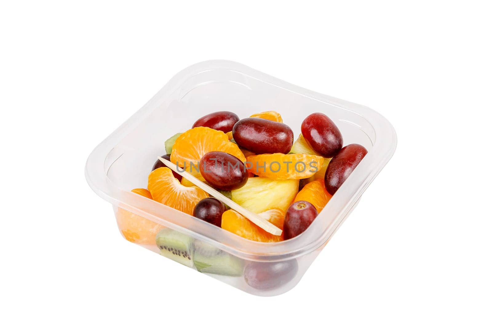 Fruit salad of pineapple, orange, kiwi and grapes in a plastic container on a white background. High quality photo