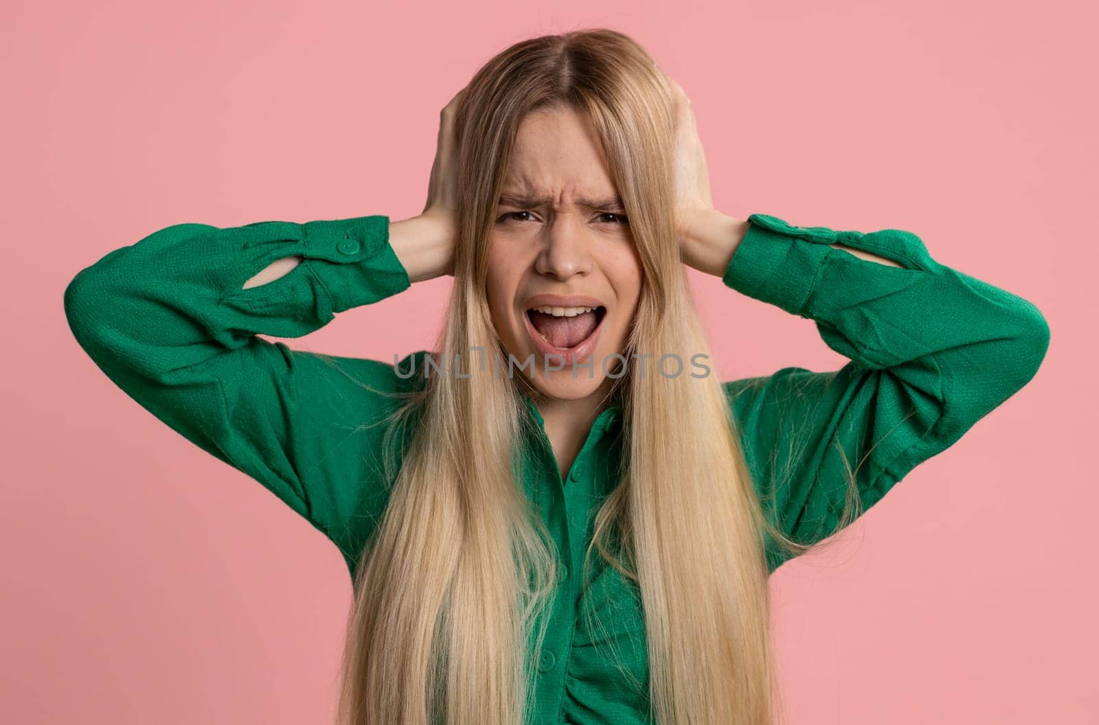 Dont want to hear and listen. Frustrated annoyed irritated caucasian woman covering ears gesturing No, avoiding advice ignoring unpleasant noise loud voices. Pretty girl alone on pink background
