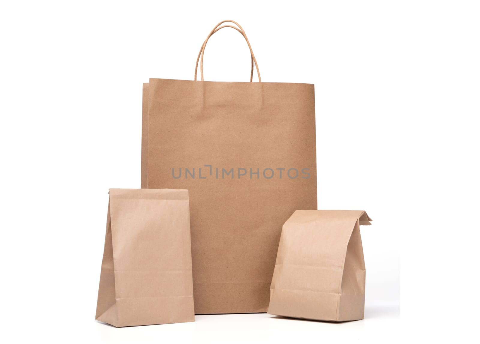 Group of lunch Paper bag and shopping paper bags isolated on a white background by PattyPhoto