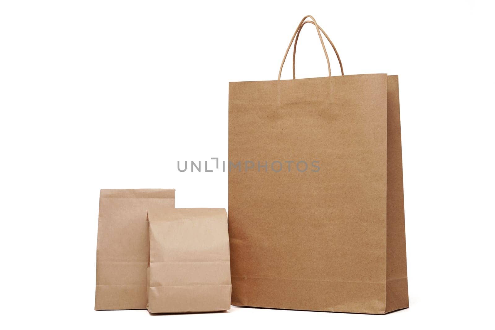 Group of lunch Paper bag and shopping paper bags isolated on a white background by PattyPhoto