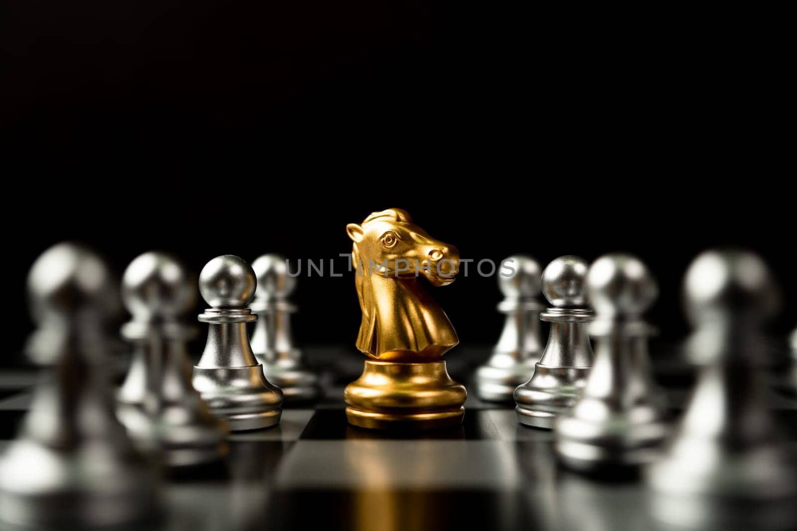 Golden Chess horse standing to Be around of other chess, Concept of a leader must have courage and challenge in the competition, leadership and business vision for a win in business games by PattyPhoto