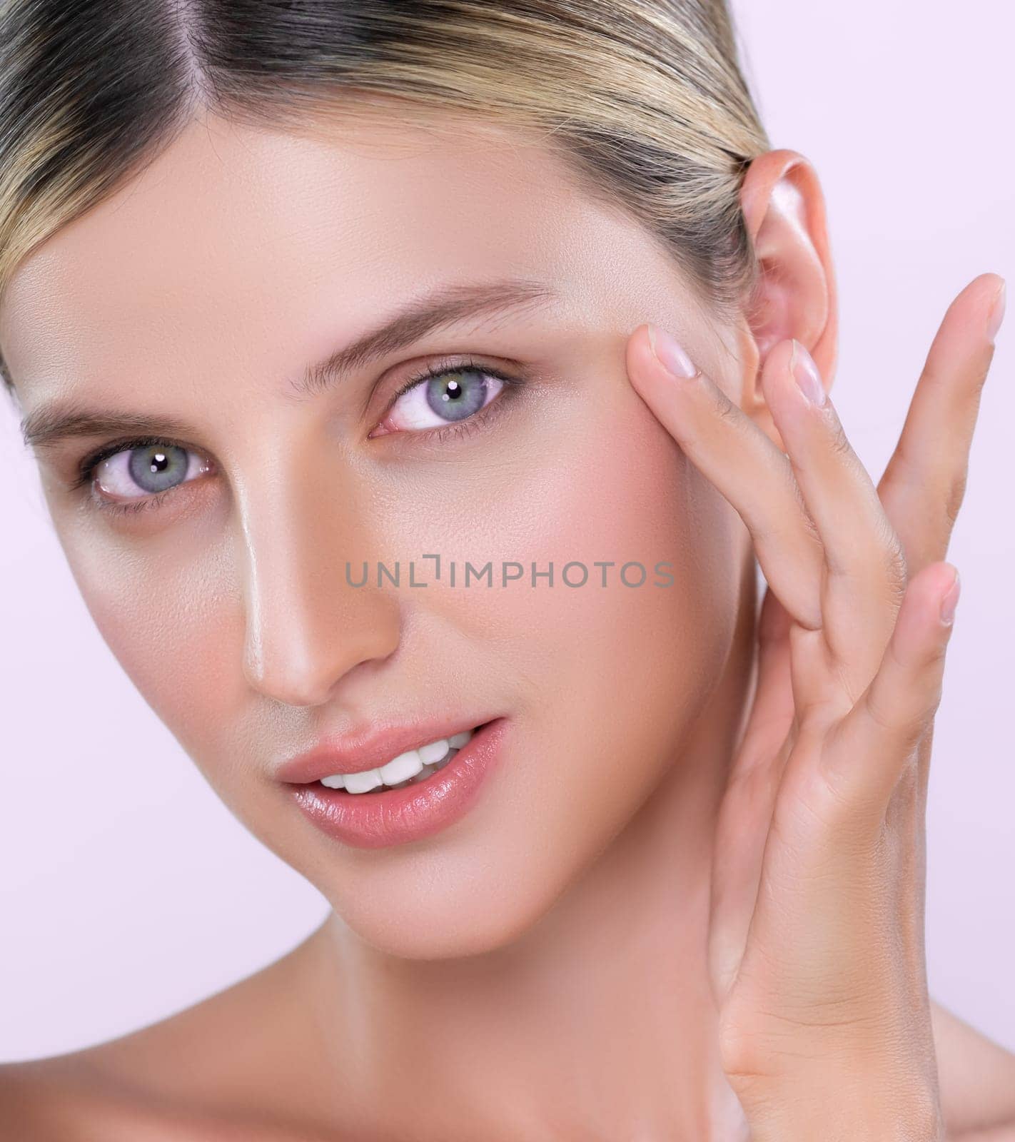 Closeup alluring beautiful woman with perfect smooth and clean skin portrait in isolated background. Beauty hand gesture with expressive facial expression for skincare treatment product or spa.