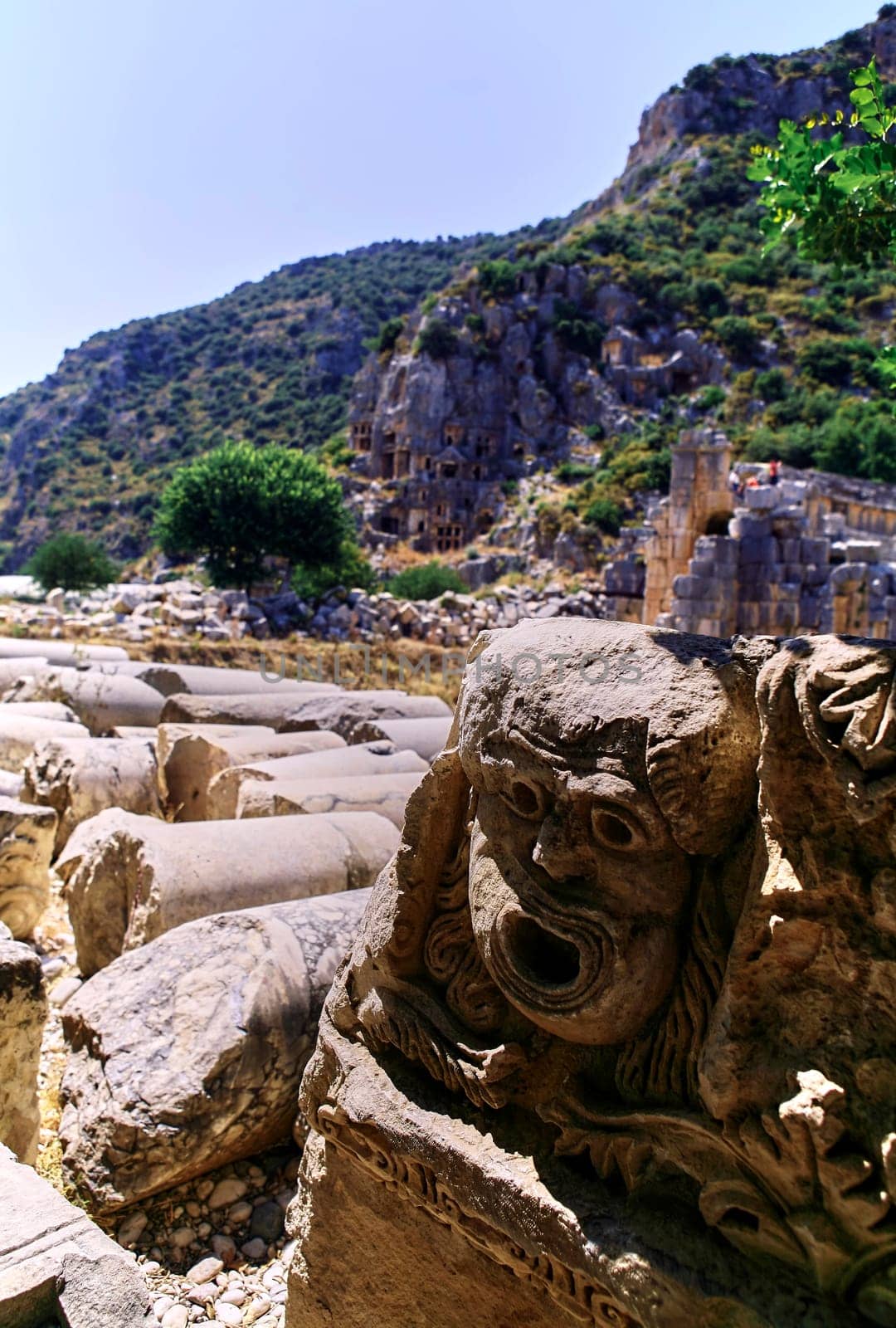 Masks of the stone theater in the ancient city of Myra. by Hil