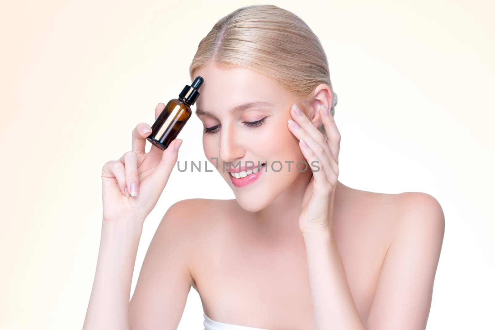 Personable portrait of beautiful woman applying essential oil bottle for skincare product. CBD oil dropper pipette for treatment and extracted cannabis concept in isolated background.