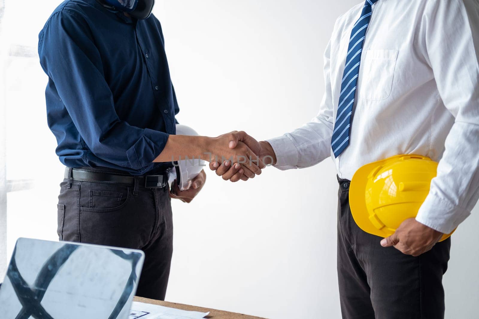 business officer engineer shaking hand each other, finishing up meeting deal plan condition, Successful business by wuttichaicci