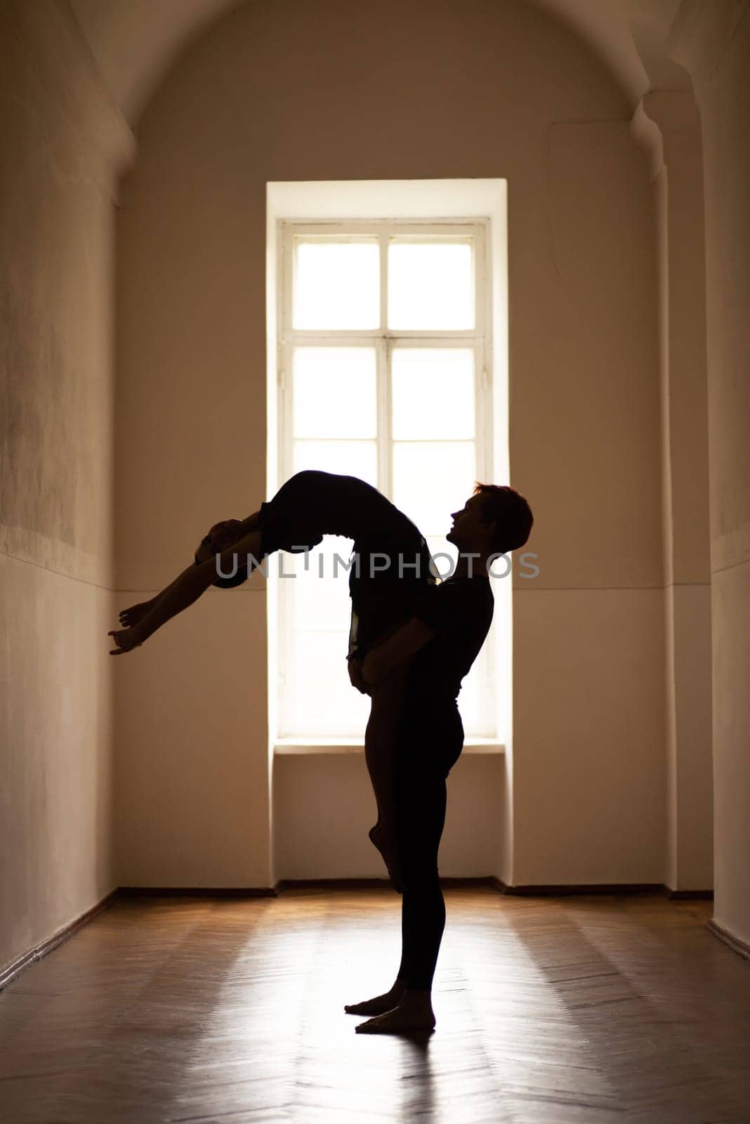 Silhouette of two professional ballet dancers