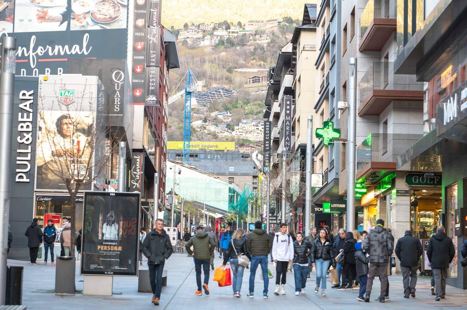 Andorra La Vella, Andorra : 2023 Aprill 15 : People Walk in the Comercial Street named Meritxell. Andorra la Vella, Andorra in winter.