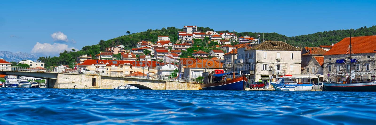 Trogir town panoramic view. UNESCO world heritage site panoramic view in Dalmatia, Croatia, tourist destination. View of sea coast in Trogir town with colorful houses