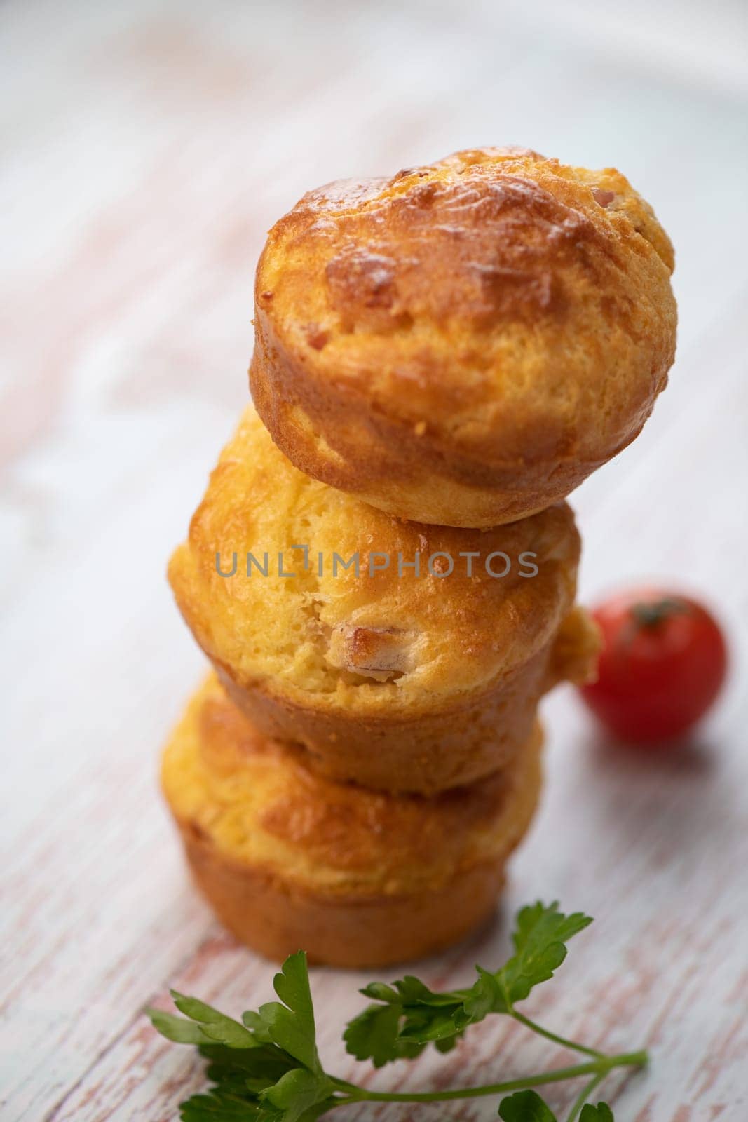 Savory muffin with ham and cheese on blue background, High quality photo