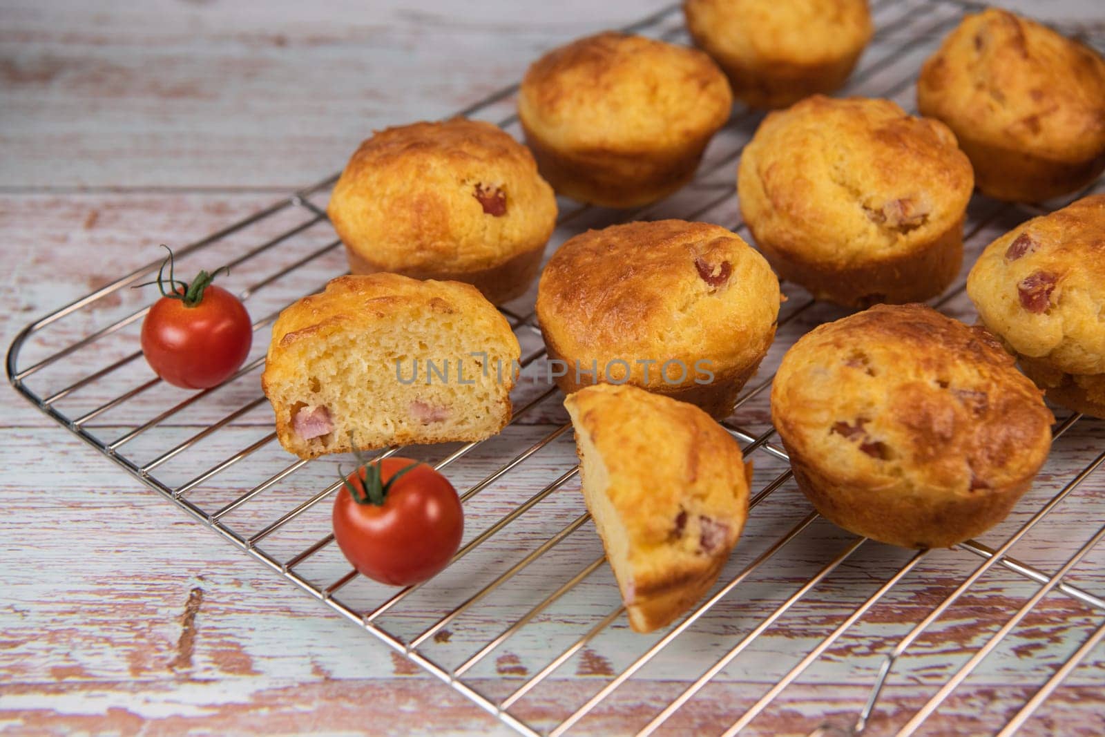 Savory muffin with ham and cheese on blue background, High quality photo
