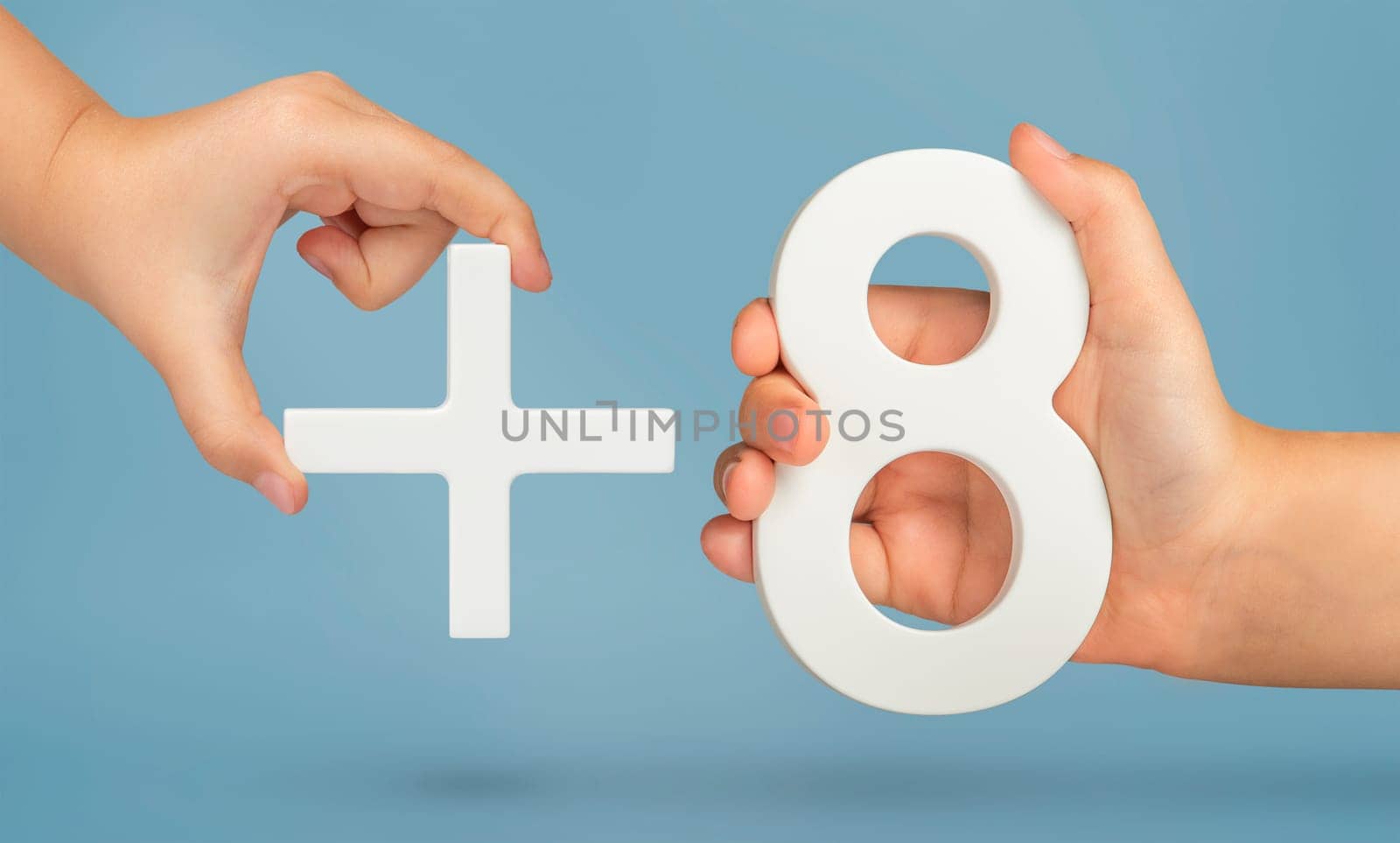 The number eight and the plus symbol in the hands of a child on a blue background. White number 8 with a plus close-up. The concept of addition or the sum of the number eight. by SERSOL