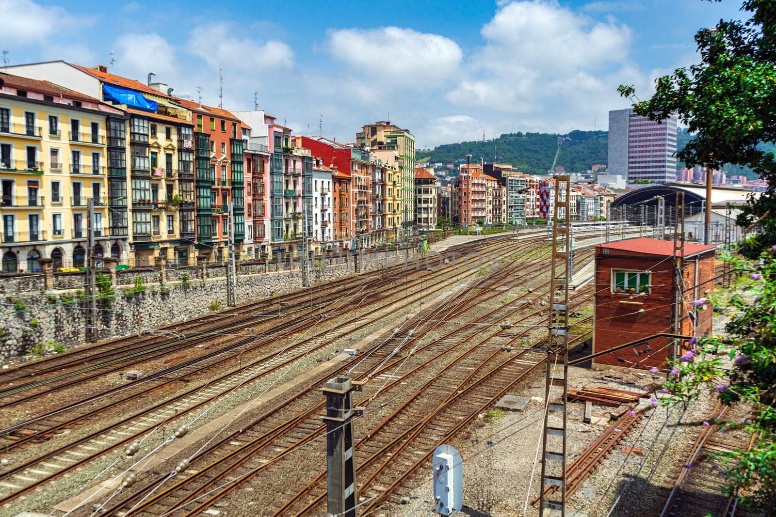 Apartment buildings located near a major railway junction. Railway rails near a residential area, Bilbao, Spain
