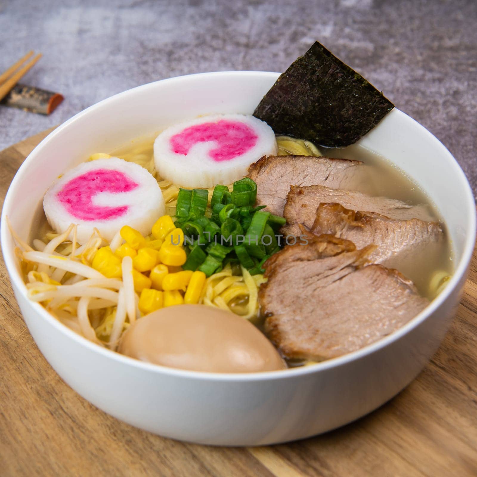 Fresh ramen noodles with garnish, pork tenderloin, eggs marinated in Mirin and soy sauce, bean sprouts, corn, nori leaf, spring onion, and homemade Narutomaki with codfish back, Hight quality