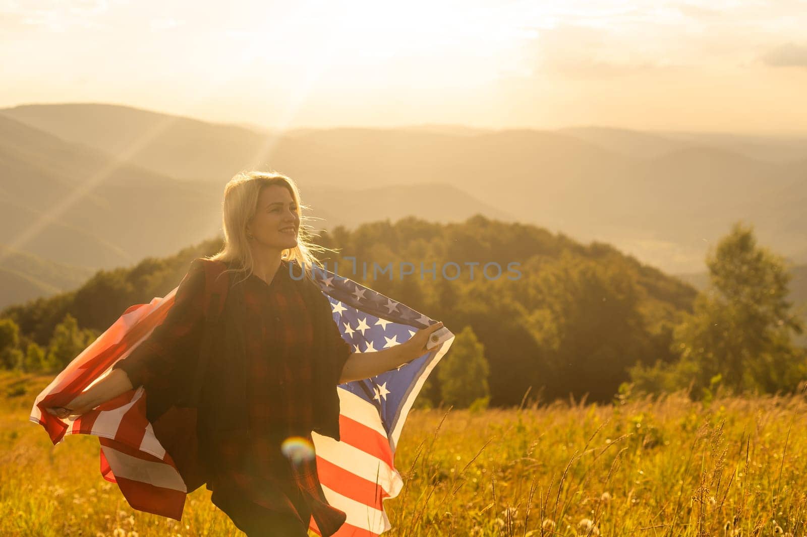 young beautiful woman holding USA flag