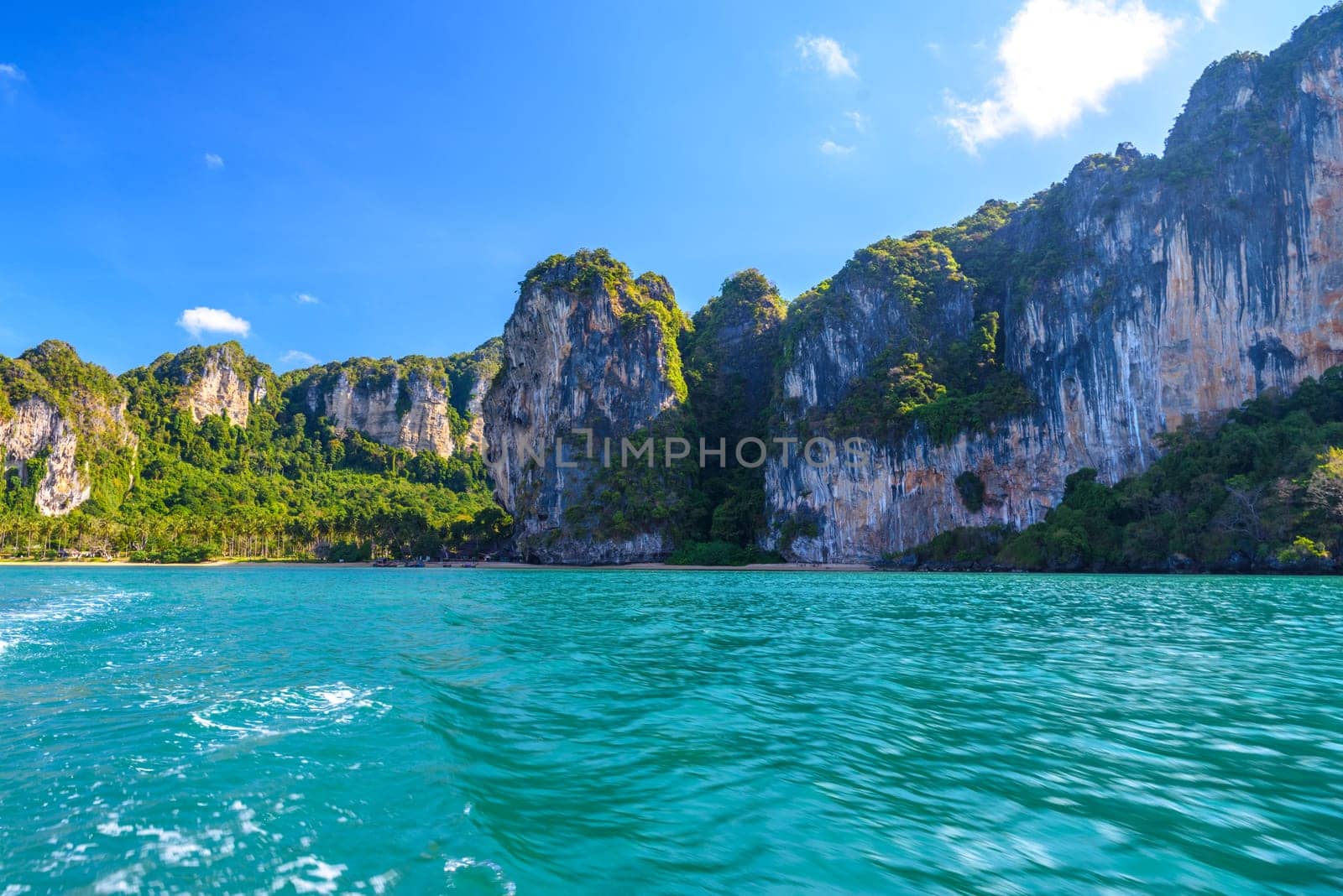 Cliff rocks with azure water in Tonsai Bay, Railay Beach, Ao Nang, Krabi, Thailand.