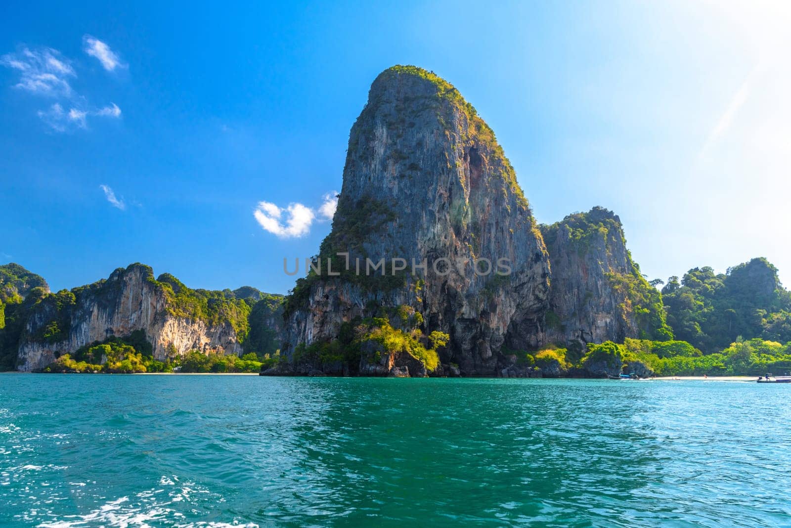 Huge cliff rocks in azure water, Railay beach, Ao Nang, Krabi, Thailand.