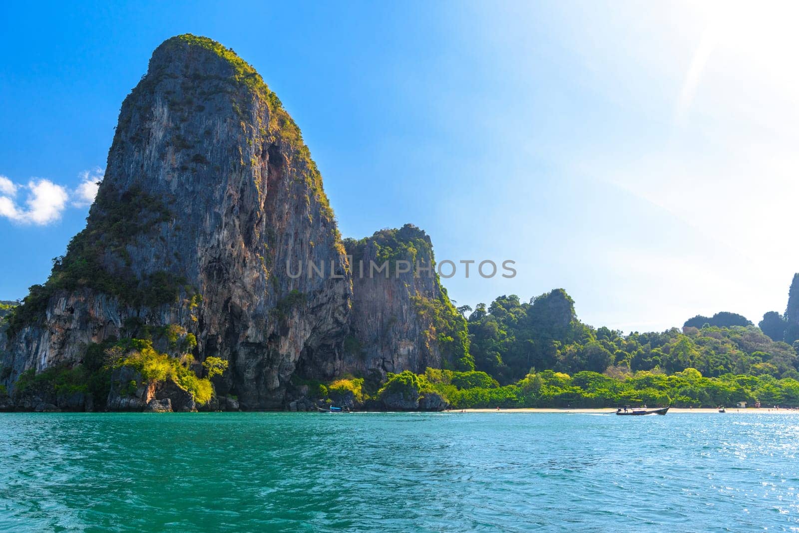 Huge cliff rocks in azure water, Railay beach, Ao Nang, Krabi, Thailand.