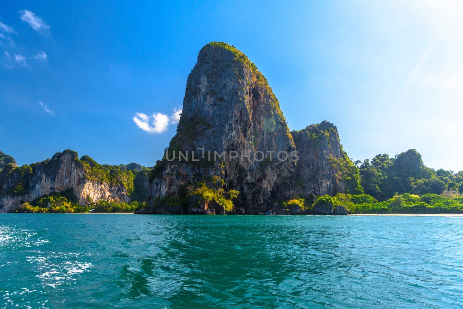 Huge cliff rocks in azure water, Railay beach, Ao Nang, Krabi, Thailand.