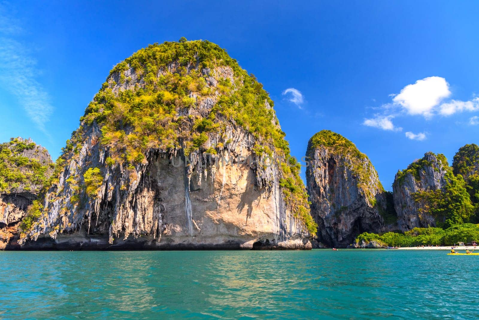 Huge cliff rocks in azure water, Ko Rang Nok, Ao Phra Nang Beach, Ao Nang, Krabi, Thailand.