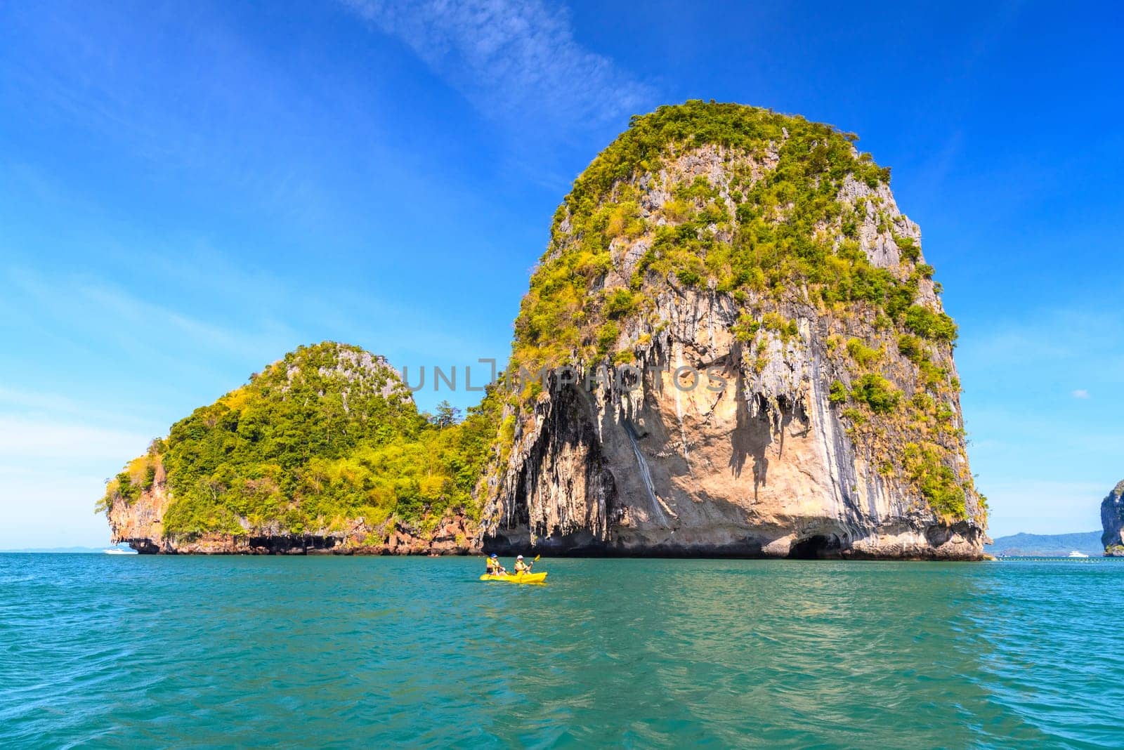 Huge cliff rock in azure water, Ko Rang Nok, Ao Phra Nang Beach, Ao Nang, Krabi, Thailand.