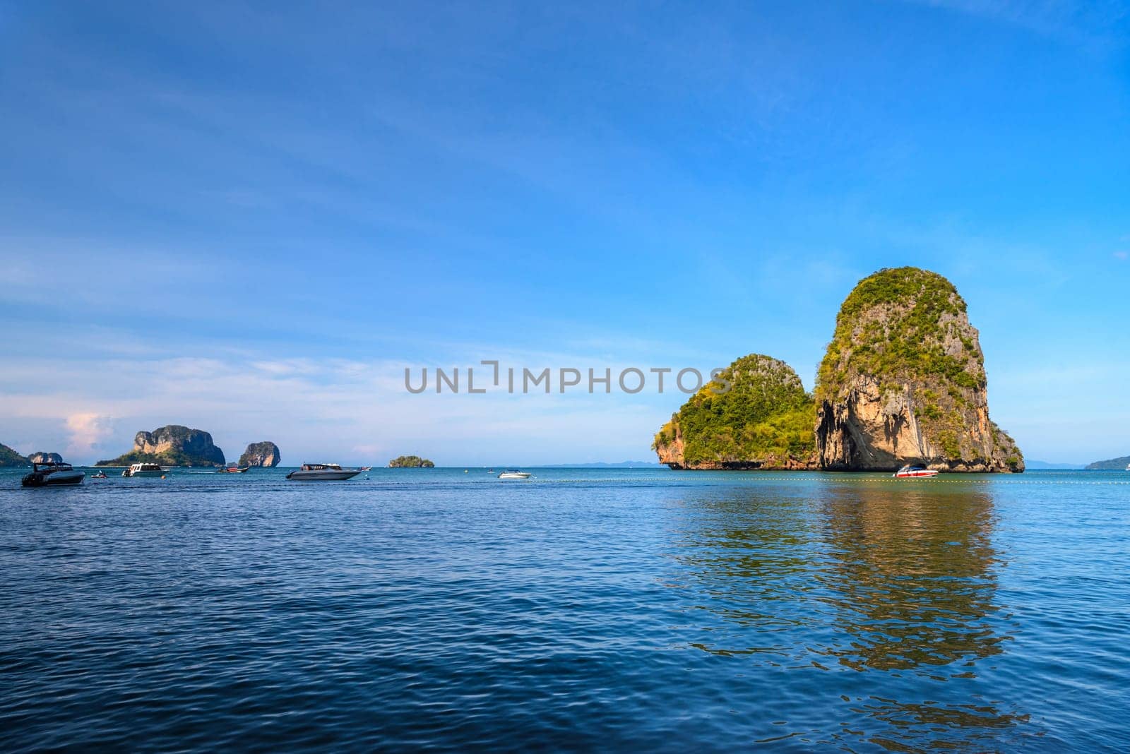 Huge cliff rock in azure water, Ko Rang Nok, Ao Phra Nang Beach, Ao Nang, Krabi, Thailand.