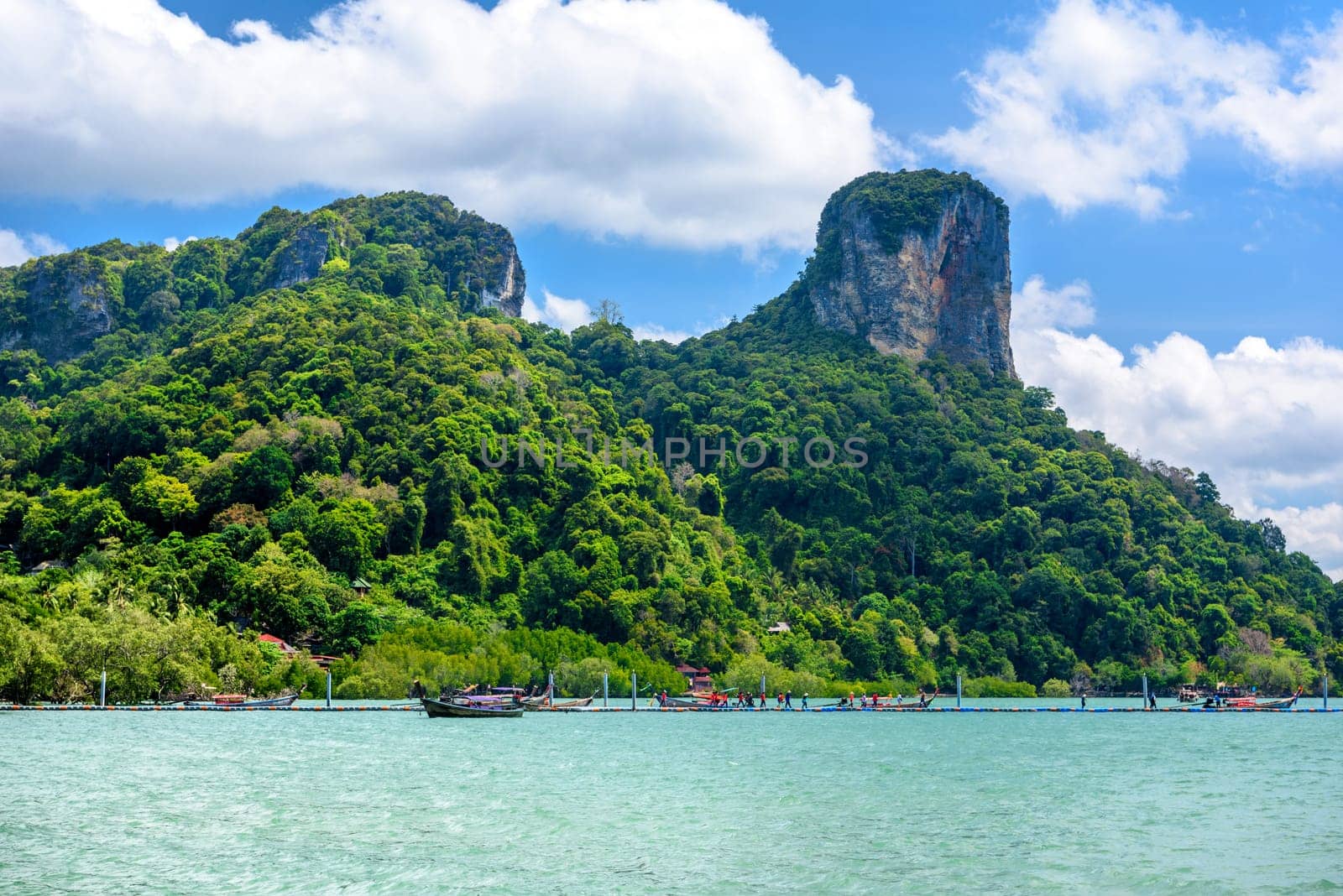 Rocks and cliffs covered with tropical trees, azure water on Ao Phra Nang Beach, Railay east Ao Nang, Krabi, Thailand.